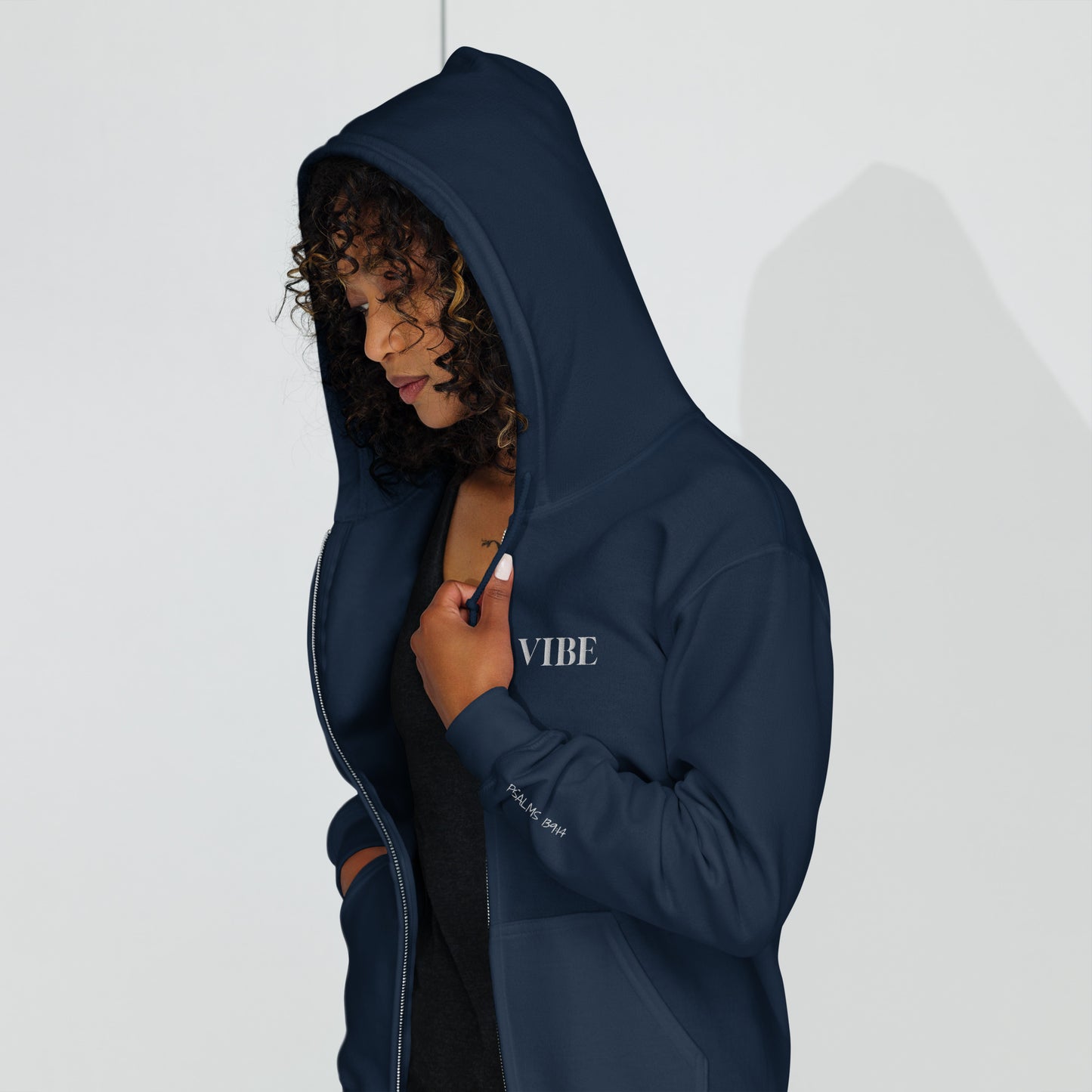 Vibe embroidered Christian zip-up hoodie in navy with white embroidery and Psalm 139:14 on sleeve modeled