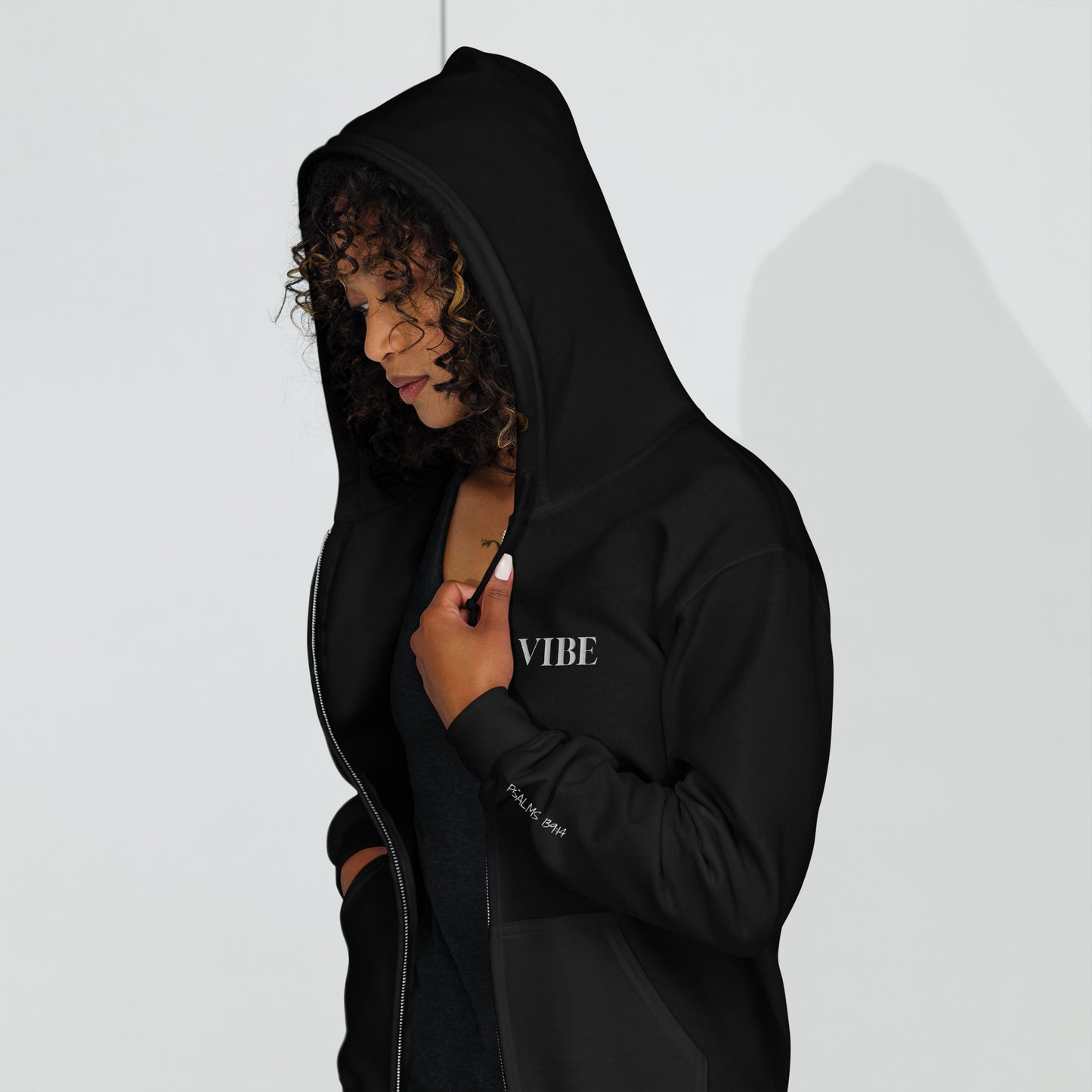 Vibe embroidered Christian zip-up hoodie in black with white embroidery and Psalm 139:14 on sleeve modeled 
