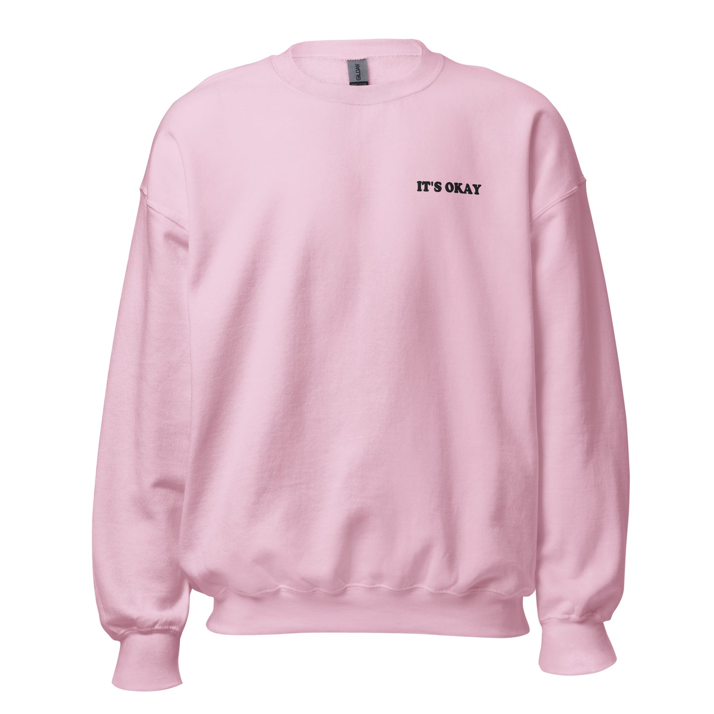 Pink sweatshirt with embroidered 'IT'S OKAY' text on a white background